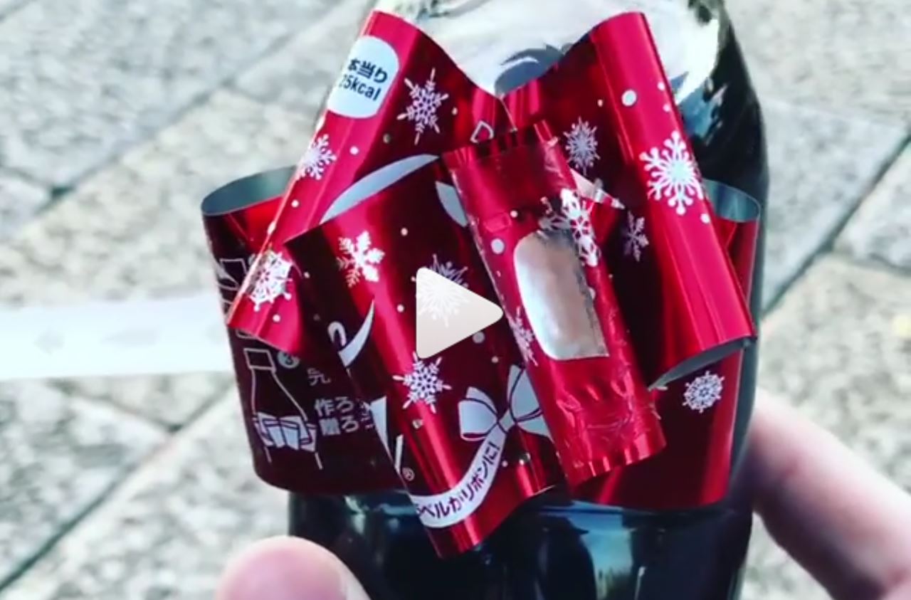 Coca-Cola Creates Bottle Wrapper That Transforms Into A Holiday Bow